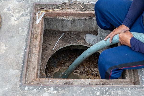 grease trap pumping removes built-up grease and solids, preventing blockages that can lead to costly repairs